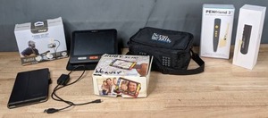 lot 376 image: Mixed Lot Small Electronics  Max Charge Flexible LED Light & Phone Holder, Humanware explore8 Handheld Magnifier, Ruby XL HD Video Magnifier, ScripTalk Station, Pen Friend 3, Orcam Read, Amazon Fire Tablet  W