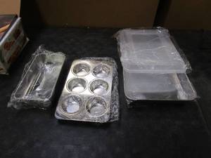 lot 249 image: 4 Piece Stainless Steel Baking Dishes - Baking Pan with Lid, Muffin Pan, Loaf Pan