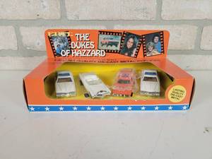 lot 195 image: 1981 ERTL Dukes of Hazzard 164 Car Set - (2) Sheriff Cars, General Lee and Boss Hoggs Cadillac