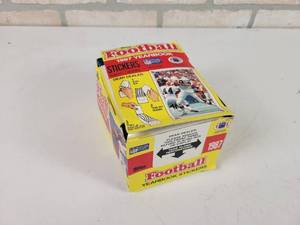 lot 221 image: 1987 Topps Football Yearbook Stickers - Contains 98 SEALED Packs