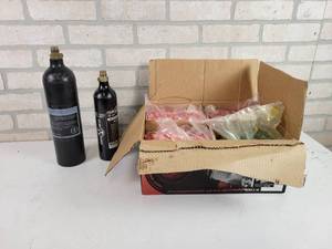lot 235 image: (2) Paintball CO2 Canisters (Empty) 24oz & 12oz  Box of Assorted Paintballs