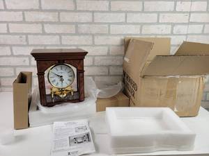 lot 255 image: Howard Miller Quartz Rotating Pendulum Clock - Open Box