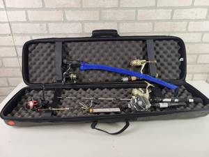 lot 180 image: Ice Fishing Gear in Scheels Case - Berkley CW100 Reel, (2) Buzz Reel BZ3, Berkley CW20 and New HTI Model JL-4W