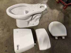 lot 12 image: Delta Foundation White Toilet, Customer returns, Review all pictures