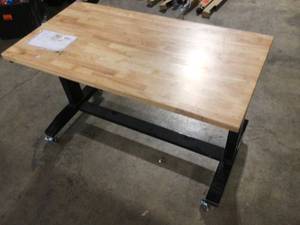 lot 27 image: Husky 62 in. W x 24 in. D Adjustable Height Solid Wood Top Workbench Table in Black, Customer return, Review all pictures