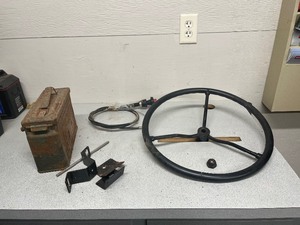 old Tractor  Steering Wheel  great shape wit nut      and ammo box