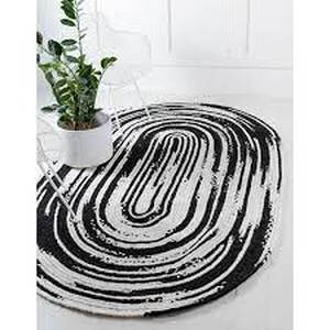 lot 41 image: Unique Loom Braided Chindi BlackWhite 5 ft. x 8 ft. Oval Area Rug