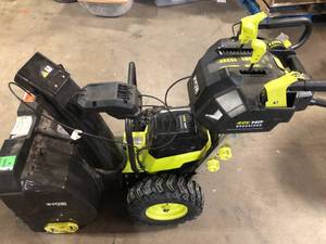 lot 15 image: RYOBI 40V HP Brushless Whisper Series 24 2-Stage Cordless Electric Self-Propelled Snow Blower  Customer return, shipping damage for parts o repair