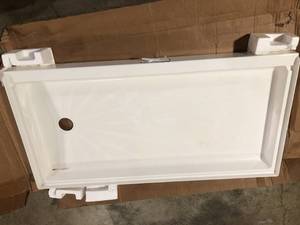 lot 20 image: Sterling STORE 60 in. x 34 in. Single-Threshold Shower Base with Center Drain in White, Open box, review all pictures