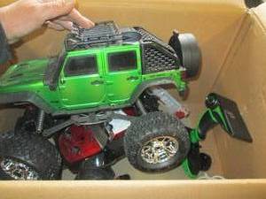 lot 292 image: 2 rc truck one has broken tire ...