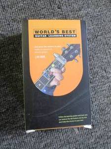 lot 381 image: worlds best guitar learning system...