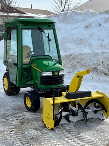 lot 1 image: John Deere X485 Garden Tractor With 47 Snowblower, 54 Mower Deck & Heated Cab