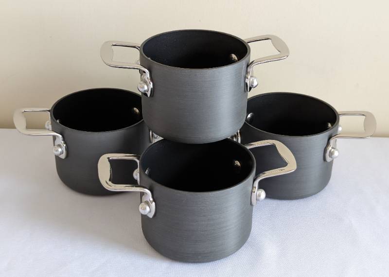 Sold at Auction: Variety of pots and pans-Cooks Essentials