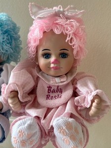 lot 104 image: Pair of Marie Osmond Baby Rosie and Baby Rags Twin Dolls