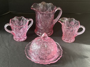 lot 106 image: Four Pieces of Inverted Thistle Glassware in Pink - Vintage Inverted Thistle Iced Tea Pitcher and More