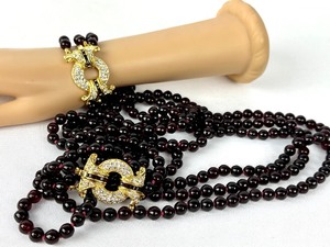 lot 256 image: Nolan Miller Triple Strand Ruby Glass Bead and Rhinestone Necklace and Double Strand Bracelet