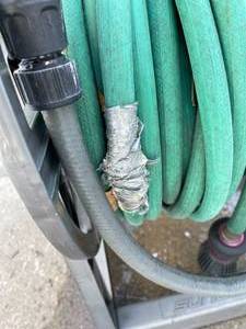 lot 371 image: Suncast Hosemobile Rolling Garden Hose Caddy with Hose