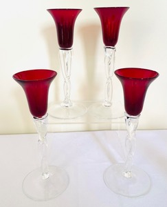 lot 79 image: Radiant Red Stemmed Glasses and Candle Holders