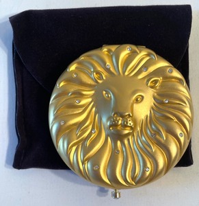lot 202 image: Estee Lauder Golden Leo Lucidity Compact