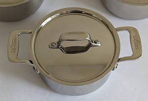 lot 20 image: Three All-Clad Stainless Steel .5 QT Pots
