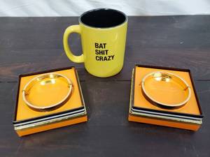 lot 25 image: Two Mudpie Bracelets And A Mug