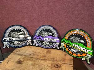 lot 25 image: 3 Metal Sturgis Black Hills Motor Classic Signs