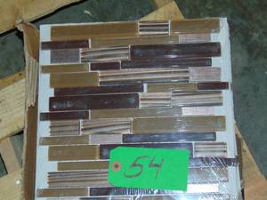 lot 54 image: 8.77 Sq. Ft. Gold Drop Brown 10.75 in. x 11.75 in. Interlocking Gloss Glass and Matte Metal Mosaic Tile (8.77 sq. ft.Case)