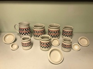 lot 23 image: Coca-Cola Kitchen 4-Piece Canister Set 1997 Checkered Board Dinnerware by Gibson