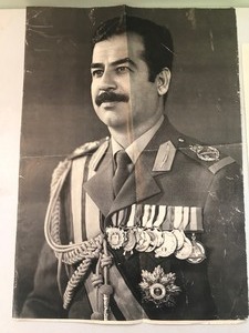 lot 174 image: Saddam Husayn in military uniform poster and small print