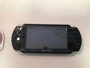 lot 323 image: Sony PSP hand held game console with game
