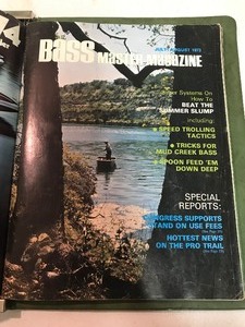 lot 338 image: The Bass Master Magazine binder with 8 vintage Bass Master Magazines inside from the 70s
