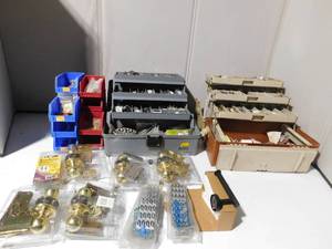 lot 402 image: Door knobs, hinges, toilet paper holder, shower wand and more