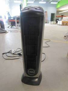 lot 290 image: Lasko Oscillating Ceramic Tower Space Heater for Home with Adjustable Thermostat, Timer and Remote Control, 22.5 Inches, GreyBlack, 1500W, 751320 (SMALL CHIP ON BOTTOM BASE)