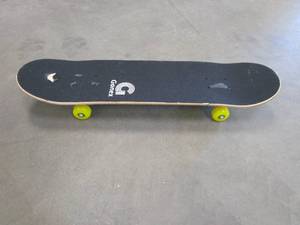 lot 324 image: Gonex Standard Skateboard for Kids Teens Adults Beginners, 31 x 8 Inch Double Kick Concave Complete Skate Board with Yellow Dice Design (TOP LAYER NEEDS TO BE REPLACED, TORN IN ONE AREA)