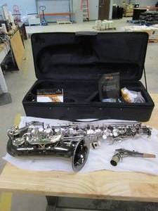 lot 388 image: Mendini By Cecilio Eb Alto Saxophone - Case, Tuner, Mouthpiece, Pocketbook- MAS-BK r E Flat Musical Instruments (MISSING 2 PEARL INLAY BUTTONS, SLIGHTLY USED)