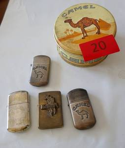 lot 20 image: 4 Vintage cigarette lighters in a Camel tin