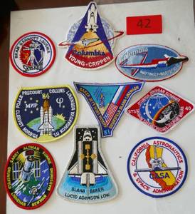 lot 42 image: 9 New NASA patches - real deal not a cheap fake version
