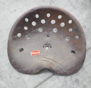 lot 108 image: Large old steel tractor seat