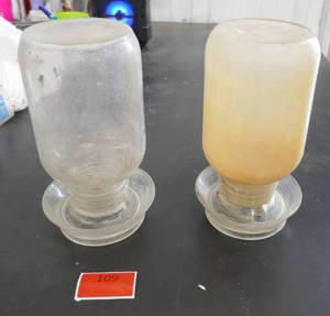 lot 109 image: 2 Vintage Glass Chicken Waterers in very good condition