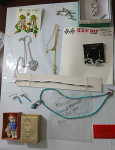 lot 152 image: Misc jewelry including a turquoise necklace and ear rings and a shoe box doll