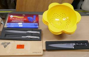lot 195 image: Kitchen items- New chef knife, 2 carving sets with fork and knife, 3 collanders and 2 silicone cookie sheets