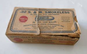 lot 283 image: Very old Remington 32 Smith & Wesson lead bullets, box is in poor shape but lots of bullets in it