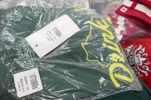 lot 296 image: Wisconsin Clothing Lot - hats and tshirts