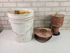 lot 529 image: Bucket of RED SNAPR T-Post Fence Insulators, Wire, Twine and More - NO SHIPPING