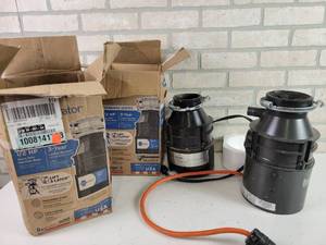 lot 723 image: (2) Used Sink Disposals - Whirlpool GC1000 works, other does not spin - NO SHIPPING