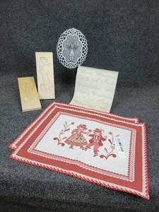 lot 658 image: Pair of Carved Angel Butter Molds, Embroidered Soldier Doily, Table Runner, and (2) Austrian Placemats