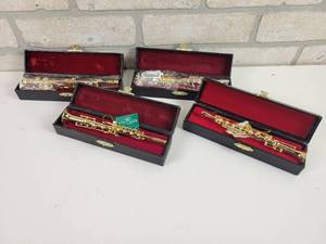 lot 623 image: (4) Kurt S. Adler Brass Musical Instrument Christmas Ornaments in Leather Cases