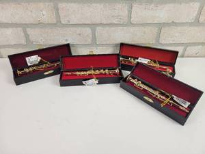 lot 624 image: (4) Kurt S. Adler Brass Musical Instrument Christmas Ornaments in Leather Cases
