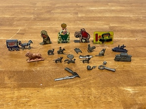 lot 26 image: Metal Cracker Jack, Checkers, and More Pieces