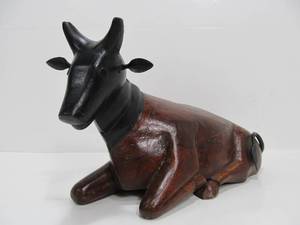 lot 71 image: Larger Hand Carved Seated Bull Statue